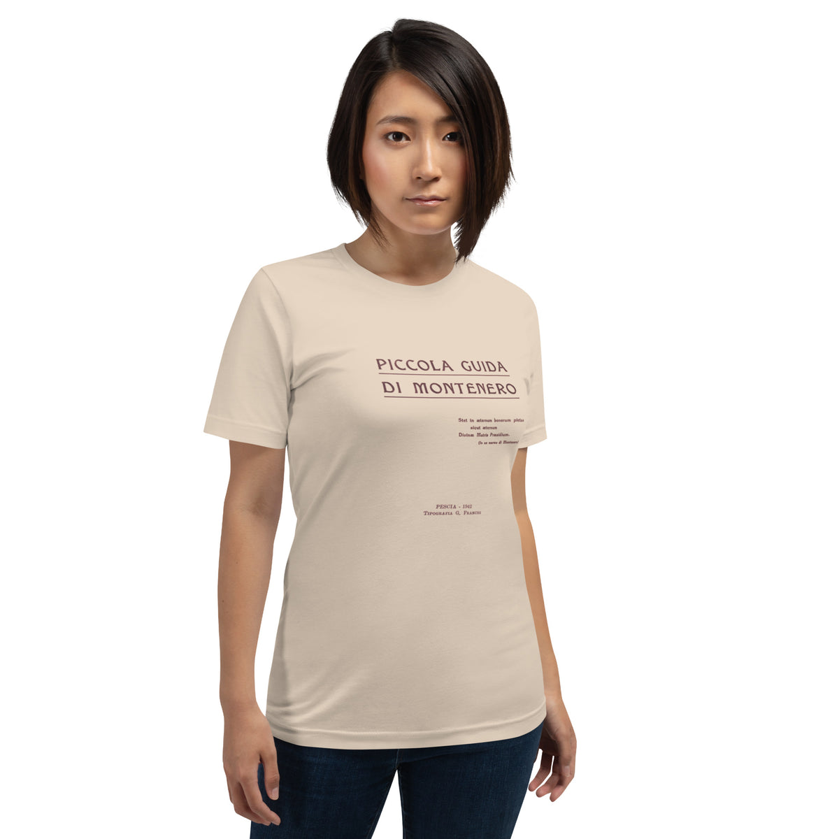 Woman wearing a beige t-shirt with a logo on a cream background